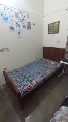 Wooden single beds with mattress (2 nos)