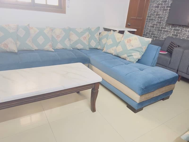 L SHAPED SOFA IN BLUE AND GREY 1