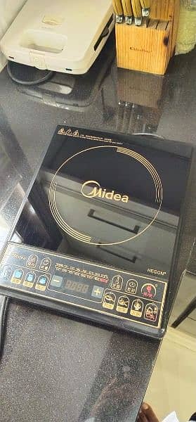 Midea electric stove induction cooker imported with 2 Induction Pans 0