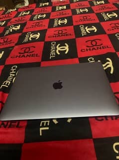 apple Mac book pro with touch panel and finger sensor