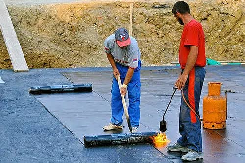 Roof leak repair services with bitumen membrane and chemical coatings 17