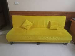 yellow common sofa with 2 cushion