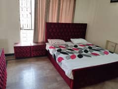 king size full cushion bed with 2 side tables