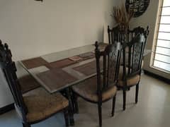 Pure shesham wood 6 seater dining table with glass top.