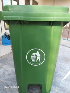 big green plastic dustbin