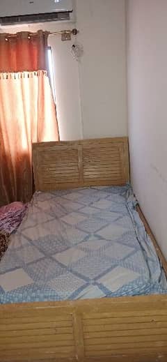 single bed without mattress.