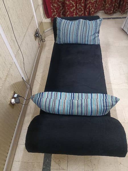 second hand Sofa or Couch in black colour with 2 cushions 1