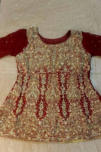 Stunning Maroon Bridal Lehenga with Exquisite Golden Embroidery 1