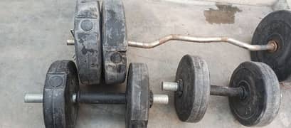 only 5000 rs Dumbles  5 kg each dumble and bench press bar 20 kg total