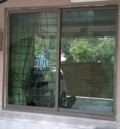 one Aluminium window with safety grill