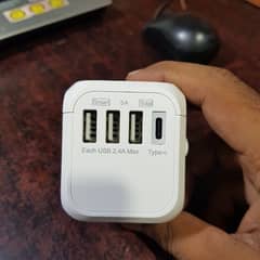 universal travel adopter with multiple charging options