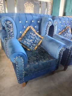 blue color sofa with cousins
