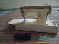 SINGER sewing machine with foot control pedal