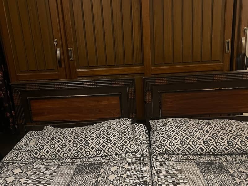 2 single beds with mattresses 1