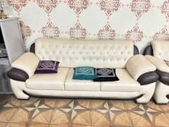 Stylish 5 Seater White Color Leather made Sofa with Cushions.