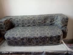 sofa cum bed and office chair.