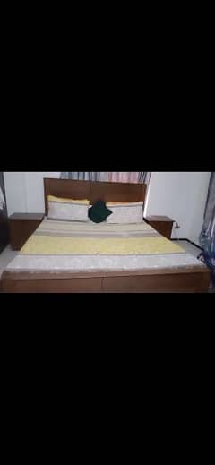 king size bed with side table with mattress