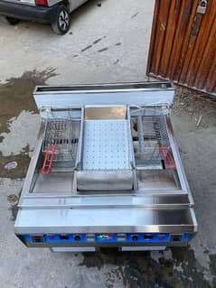double deep fryer with sizzling, cooking range