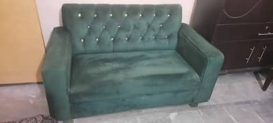 Green two seater sofa branded