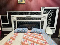 bed and saide table with mattress