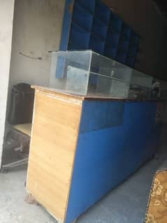counter for sell and 1 chair.