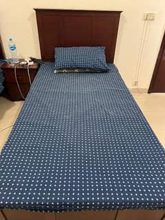 single beds with side table and master matress