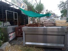 steel made counter with burners and a burger counter