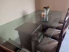 Glass Top Dinning Table With 8 Chairs.