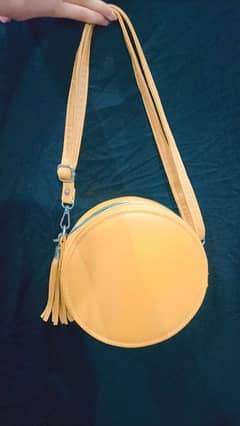 circle shaped mustard color leather bag with free delivery charges