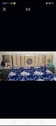 Queen size bed with sidetables curtains and rug
