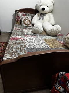 Pure old wooden single bed with mattress