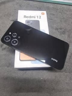 redmi 12 with box charger 8/128 5 month warranty remaining