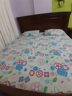 good condition bed with side table