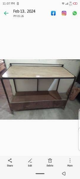 selling iron table with marble n wheels 1
