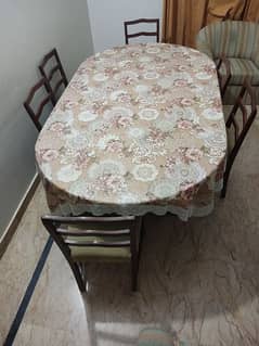 a luxurious dining table with 6 chair all are new condition