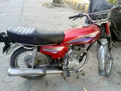 Honda 125 in good condition red colour