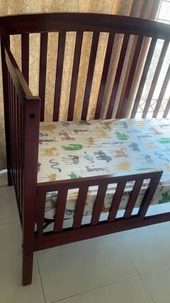 wooden cot with mattress