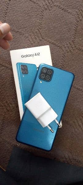 Samsung galaxy a12 box and charging adopter 0