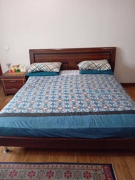 wooden beds with mattress and side tables 2