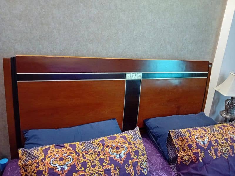 wooden beds with mattress and side tables 3