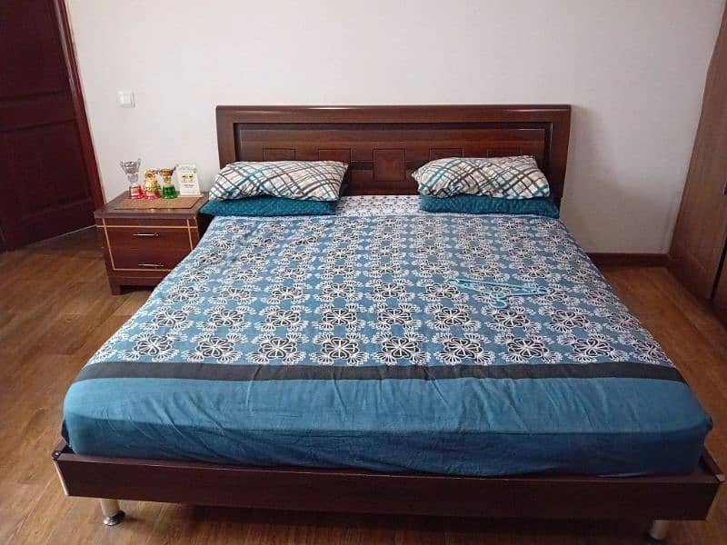wooden beds with mattress and side tables 4