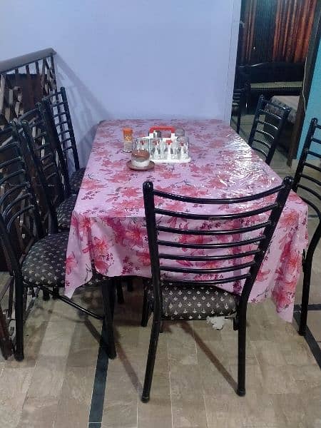 dinng table with 6 chairs. 3