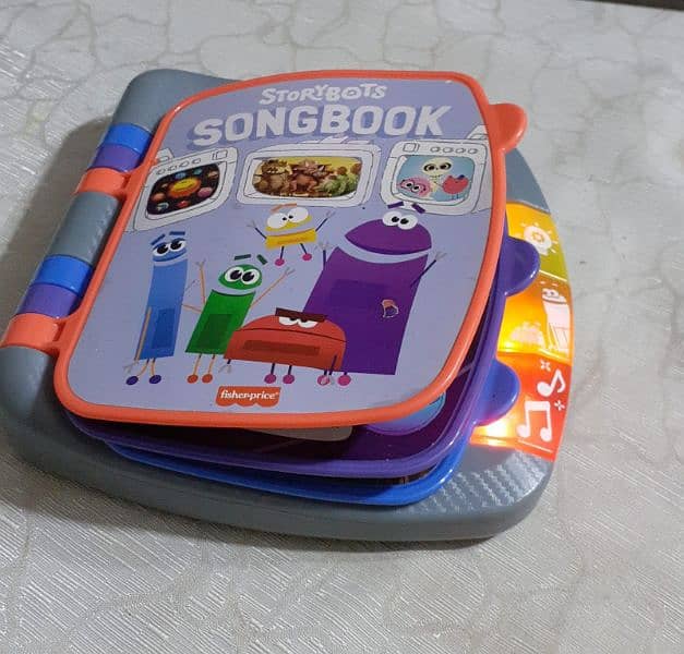 Toy Fisher price play n learn Story-bots song book 0