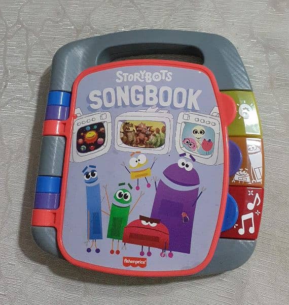 Toy Fisher price play n learn Story-bots song book 1