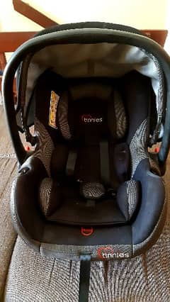 Tinnies baby cot/ car seat