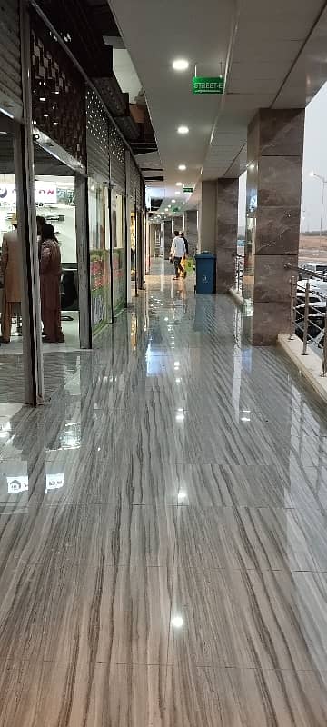 A. Q super market ground floor ready shop available for sale in bahria Town Karachi 11