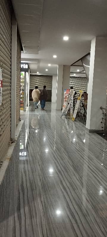 A. Q super market ground floor ready shop available for sale in bahria Town Karachi 21