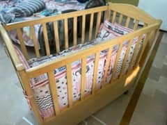 Wooden cot / crib with Bedding