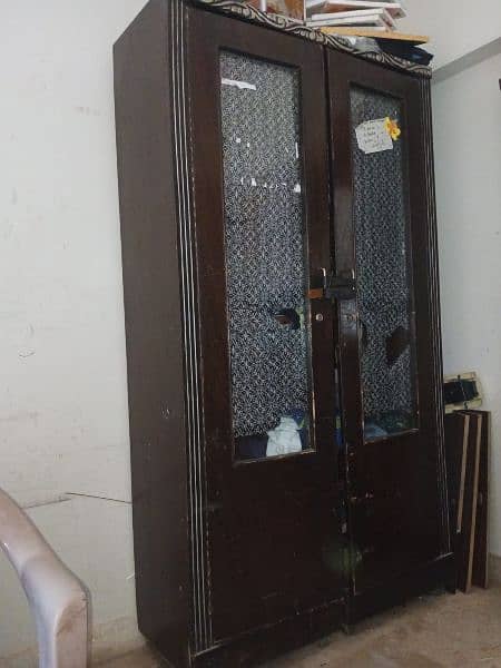 Salam, I want to sell sheesham wood devider +cupboard 2