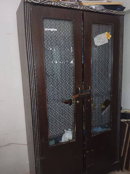 Salam, I want to sell sheesham wood devider +cupboard 3